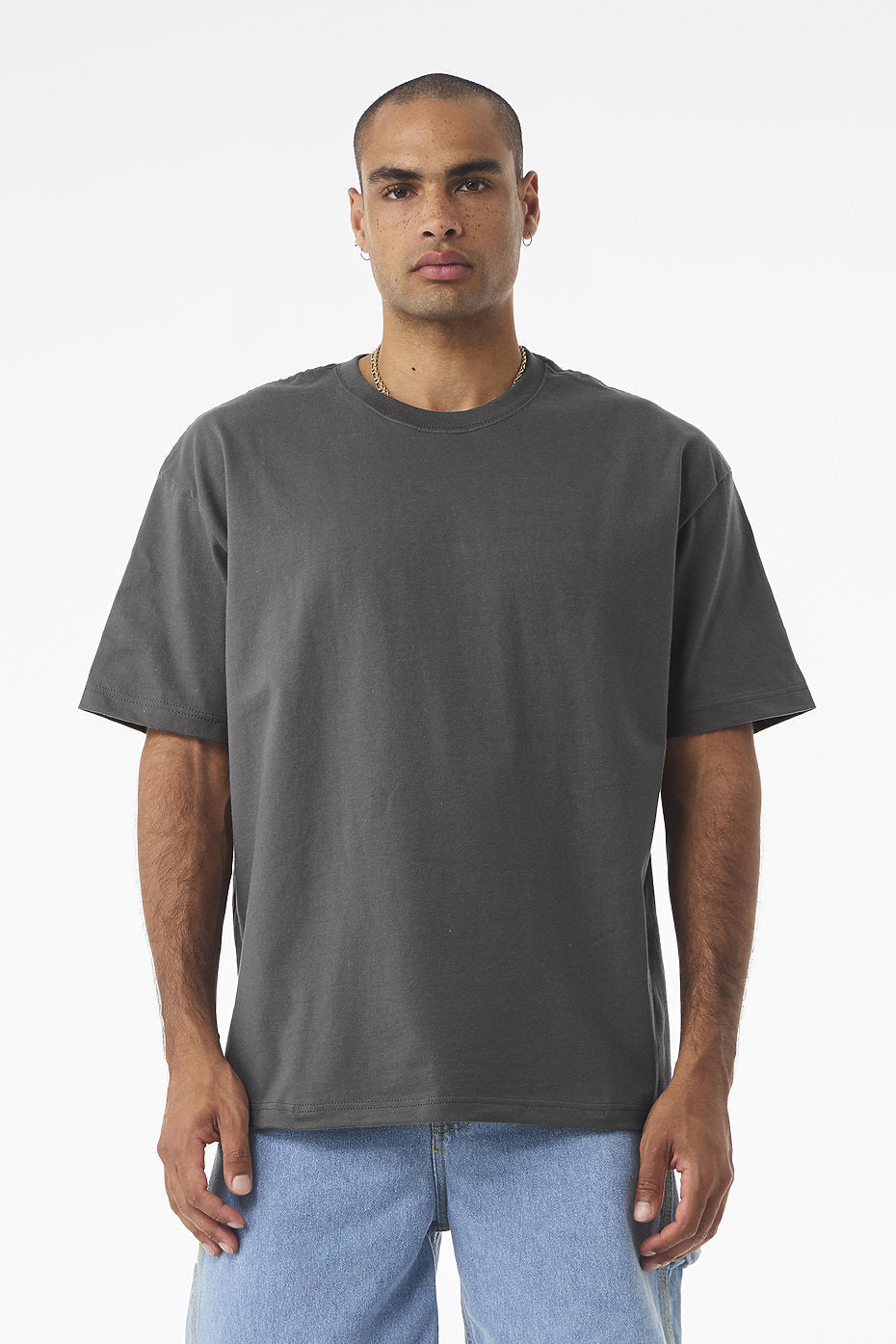 Unisex Heavyweight Tee Bella+Canvas 4610 in dark grey with boxy fit and drop shoulders modeled by a man