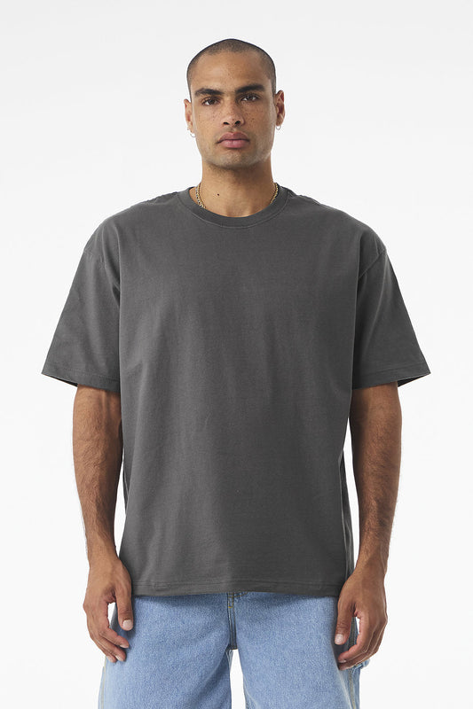 Unisex Heavyweight Tee Bella+Canvas 4610 in dark grey with boxy fit and drop shoulders modeled by a man