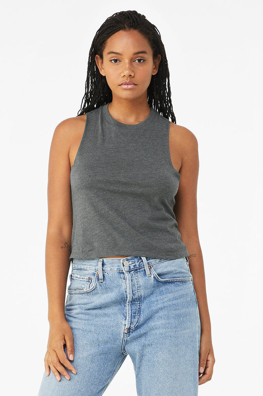 Woman wearing gray women's racerback cropped tank with raw edge armholes and relaxed fit paired with blue jeans
